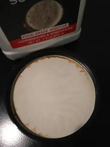 Brown stain on inner side of the lid