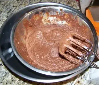 Melted chocolate/coconut milk mixture in ice bath - cool