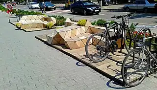 Parklet with seatings and bicycle parking.