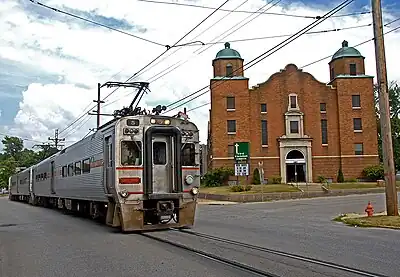 A train of the South Shore Line running on public roads in Michigan City (which has been segregated since 2022)