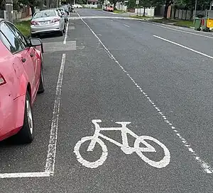 A bike lane in Melbourne with parking on the left hand side