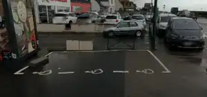 a disabled parking space with pictograms