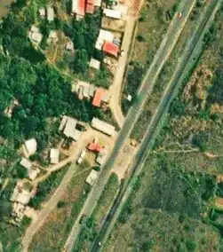 Calles urbanas "pegándose" a la Autopista San Cristóbal - La Fría.