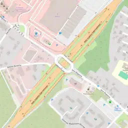 A typical grade-separated interchange between a highway=primary and a highway=tertiary. Ramps tagged as highway=primary_link – matching the higher classification.