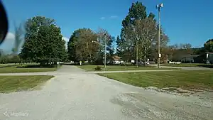 Pole-mounted tornado siren in the United States, identifiable by the unique horn shape: emergency=siren siren:purpose=tornado siren:type=electronic manufacturer=Whelen Engineering Company manufacturer:wikidata=Q7992391 siren:model=WPS-4000 [3] man_made=mast tower:type=siren support=pole