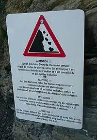 Rockslide warning at the Bisse du Ro, Canton Valais, Switzerland (traffic_sign=hazard + hazard=landslide)