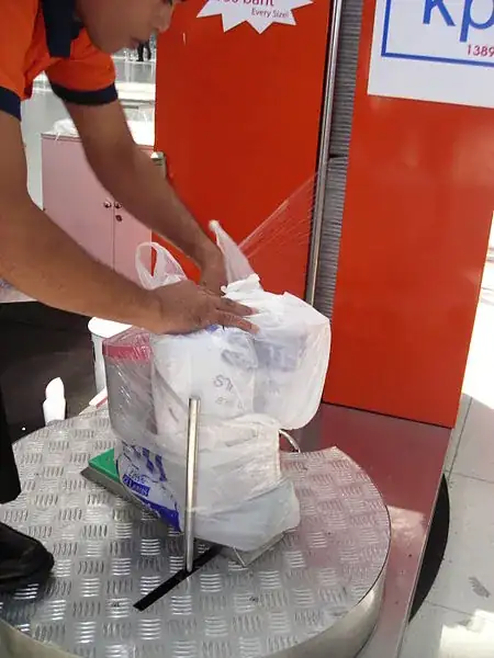 airport shrinkwrap luggage