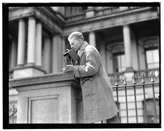 a statue in front of a ?neo-classical building