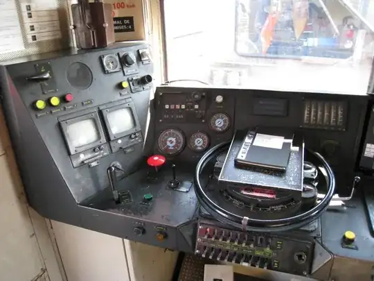 Driving cab interior with EAS screens on the left