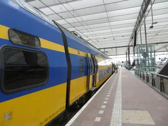 a dutch train on a platform