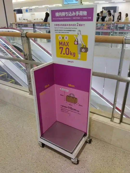 Carry-on scale at international Peach check-in