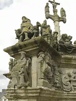 The horseman leading the cortege of Christ Carrying the Cross. In the niche below we see the seated St Matthew.