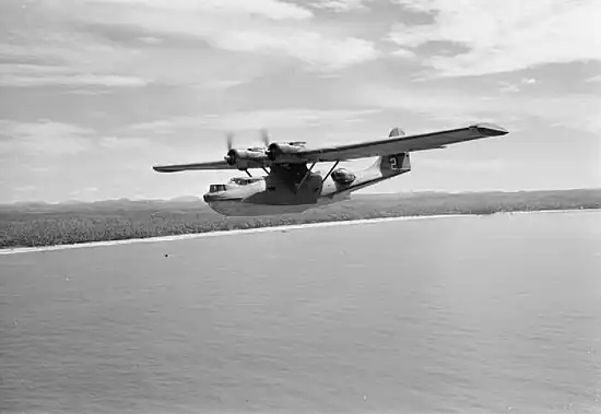 The QEA Catalina G-AGFL "Altair Star" flying along the coast of Ceylon at the conclusion of a 'Double Sunrise' flight from Australia which operated from July 1943-July 1945.
