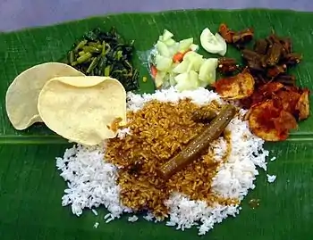 Image 104A typical serving of banana leaf rice. (from Malaysian cuisine)