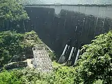 Bhumibol Dam, 154 metres (505&nbsp;ft) long, creating a reservoir with a surface area of 300 square kilometres (120&nbsp;sq&nbsp;mi).