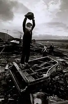 Image 42Boy destroying piano at Pant-y-Waen, South Wales, by Philip Jones Griffiths, 1961 (from Photojournalism)