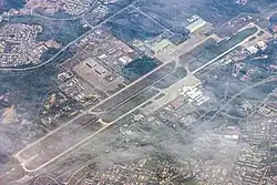 Royal Brunei Air Force Base, Rimba (top left) shares its 3,685 metres (12,090&nbsp;ft) runway with the Brunei International Airport (bottom right), 2016.
