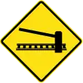PI-1bRailway crossing ahead with gates or barriers