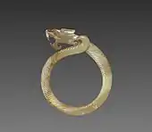 Fluted ring with a dragon head (huan); circa 475 BC; jade (nephrite); overall: 9.1 centimetres (3.6&nbsp;in); Cleveland Museum of Art (Cleveland)