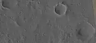 One crater here has a depression on  its floor.  This may be due to the impacting body going down to a softer material.