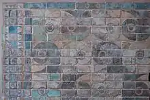 Decorative patterns, detail from the griffins' frieze in Darius' palace at Susa. Glazed siliceous bricks, ca. 510 BC.