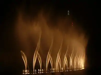 Dubai Fountain (2008), a computer-programmed musical fountain, is 250&nbsp;m (820&nbsp;ft) long and can jet water 150&nbsp;m (490&nbsp;ft) into the air