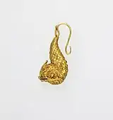 Earring in the form of a dolphin; 5th century BC; gold; 2.1 by 1.4 by 4.9 centimetres (0.83&nbsp;in ×&nbsp;0.55&nbsp;in ×&nbsp;1.93&nbsp;in); Metropolitan Museum of Art