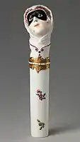 "Toy" needlecase with the head of Columbina, c. 1760, height: 4+7⁄8 inches (12&nbsp;cm). Inscribed on enamel band on mount: NE SOYEZ POINT CRUELE ("Don't be so cruel")