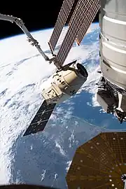 Dragon grappled by the ISS