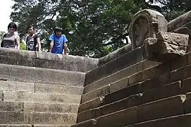 Nāga sculpture and stone spout in north pond