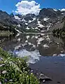 Navajo Peak, Apache Peak, and Shoshoni Peak reflected in Lake Isabelle