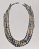 Sumerian necklace beads; 2600–2500 BC; gold and lapis lazuli; length: 54 centimetres (21&nbsp;in); Metropolitan Museum of Art