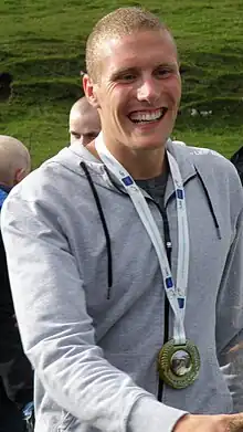 Image 4Pál Joensen after coming back home to his hometown Vágur after winning a silver medal at the 2010 European Aquatics Championships (from Culture of the Faroe Islands)