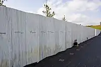 White granite wall with engraved names
