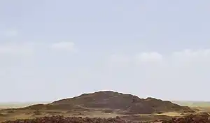A photograph of the mound of sand that comprises the destroyed remains of the pyramid, called 'Merenre's beauty shines', which belonged to Merenre Nemtyemsaf&nbsp;I.