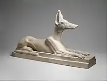 Recumbent Anubis; 664–30 BC; limestone, originally painted black; height: 38.1&nbsp;cm, length: 64&nbsp;cm, width: 16.5&nbsp;cm; Metropolitan Museum of Art