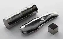 Rhenium single crystal, a remelted bar, and a 1&nbsp;cm3 rhenium cube for comparison