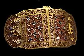 Shoulder-clasps from Sutton Hoo; early 7th century; gold, glass & garnet; length: 12.7 centimetres (5.0&nbsp;in); British Museum (London)