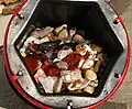 A 6.8&nbsp;kg (15&nbsp;lb) barrel full of tumble-polished agate and jasper