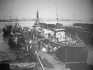 USS Absegami (SP-371) is at left center in this photograph of United States Navy patrol vessels at Philadelphia, Pennsylvania, on 15 January 1919. Astern of Absegami is a section patrol boat identified only as SP-1595 (left background). Across the pier are the submarine chaser USS&nbsp;SC-23 (right background), and an unidentified submarine chaser (right foreground).
