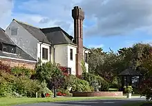 Western House, Ayr. An Arts and Crafts house designed and built by architect Harold Ogle Tarbolton (1919-25) for David Shaw, racecourse manager, and the Western Club. Owned by Ayr racecourse and operates as a hotel. Listed building LB47172.