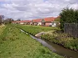 Westfield Beck behind housing on the west of New Earswick